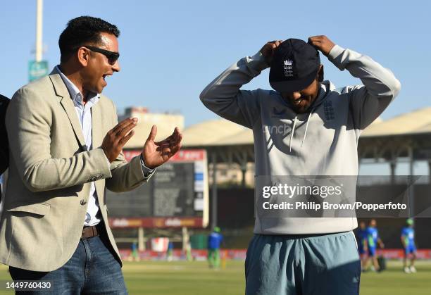 Rehan Ahmed of England with his father Naeem after receiving his cap before the first day of the third Test between Pakistan and England at Karachi...