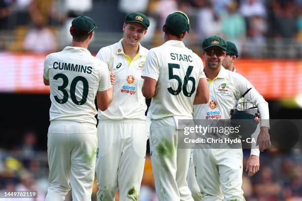 Cameron Green of Australia with team mates during day one of the First Test match between Australia and South Africa at The Gabba on December 17,...