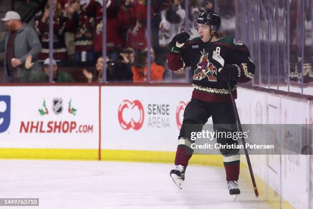 Clayton Keller of the Arizona Coyotes celebrates after scoring a goal against the New York Islanders during the third period of the NHL game at...
