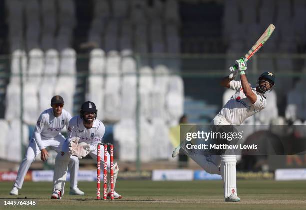 Shan Masood of Pakistan hits the ball towards the boundary during day one of the Third Test match between Pakistan and England at Karachi National...