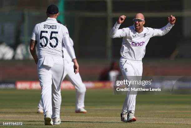 Jack Leach of England celebrates the wicket of Abdullah Shafique of Pakistan during day one of the Third Test match between Pakistan and England at...