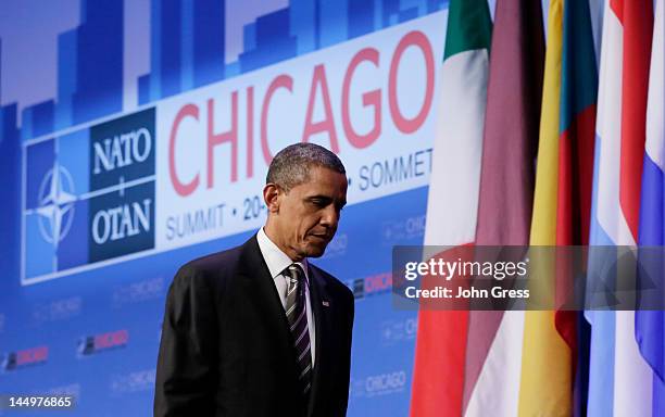 President Barack Obama leaves his closing press conference at the closing of the NATO summit on May 21, 2012 at McCormick Place in Chicago, Illinois....