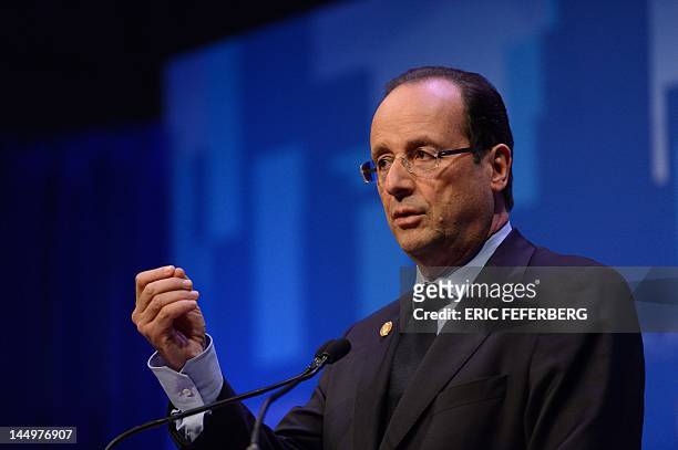 French President Francois Hollande holds a press conference at the conclusion of the NATO 2012 Summit in Chicago on May 21, 2012. AFP PHOTO/ERIC...