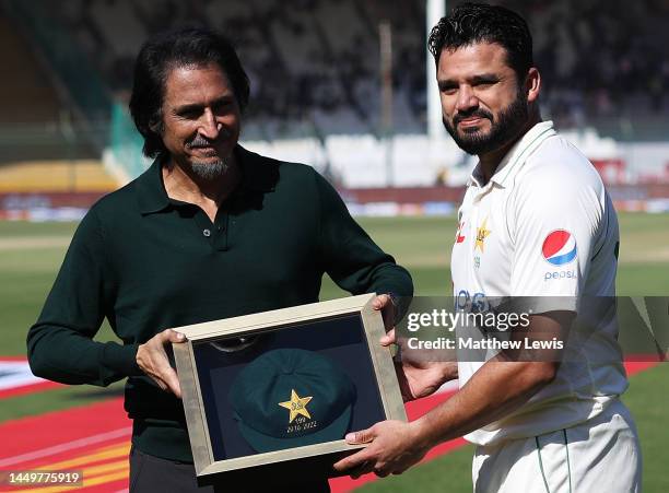 Ramiz Raja, Chairman of the PCB presents Azhar Ali of Pakistan with a cap, after his announcement of retiring from International Cricket during day...