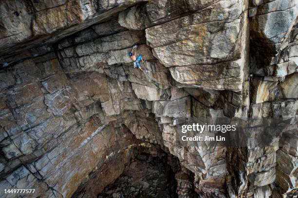 rock climbing in a giant cave - texture lin stock pictures, royalty-free photos & images