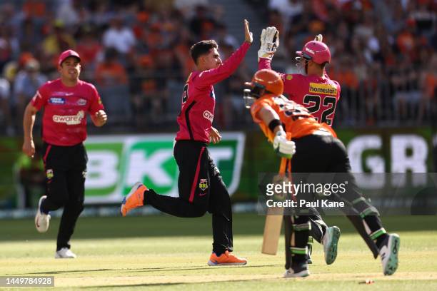Izharulhaq Naveed of the Sixers celebrates the wicket of Josh Inglis of the Scorchers during the Men's Big Bash League match between the Perth...