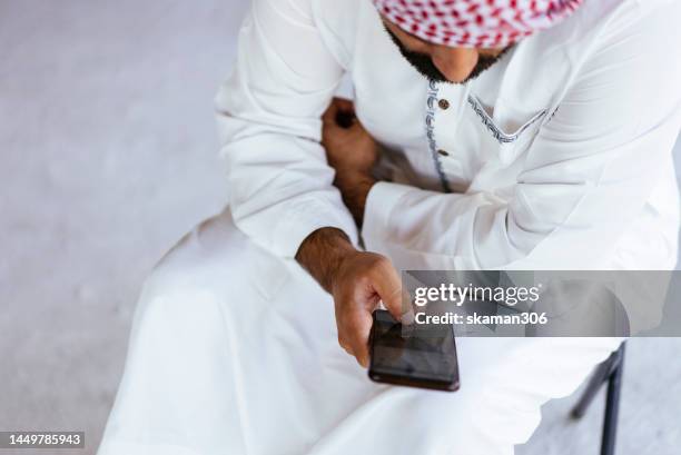 positive emotion arab investors, engineers, and architects coordinate to plan and discuss problems related to construction on the site. brainstorm,teamwork, - arabic letters stock pictures, royalty-free photos & images