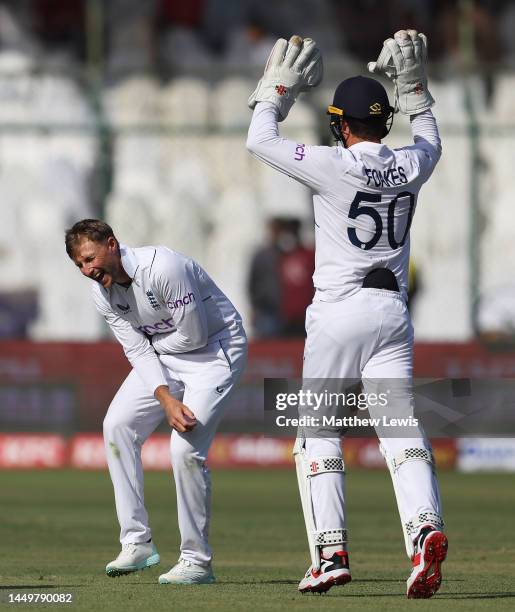 Joe Root of England celebrates the wicket of Mohammad Rizwan of Pakistan during day one of the Third Test match between Pakistan and England at...