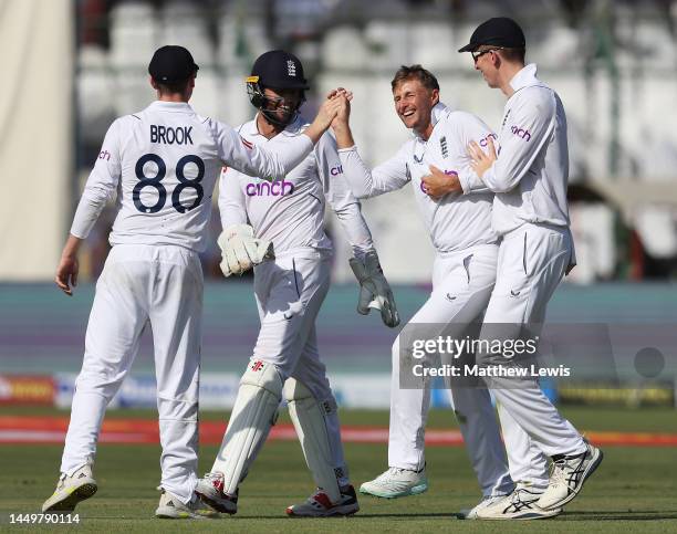 Joe Root of England is congratulated on the wicket of Mohammad Rizwan of Pakistan during day one of the Third Test match between Pakistan and England...