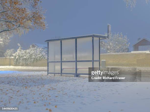 a bus stop in the snow, cambridgeshire, uk. - cambridge street stock pictures, royalty-free photos & images