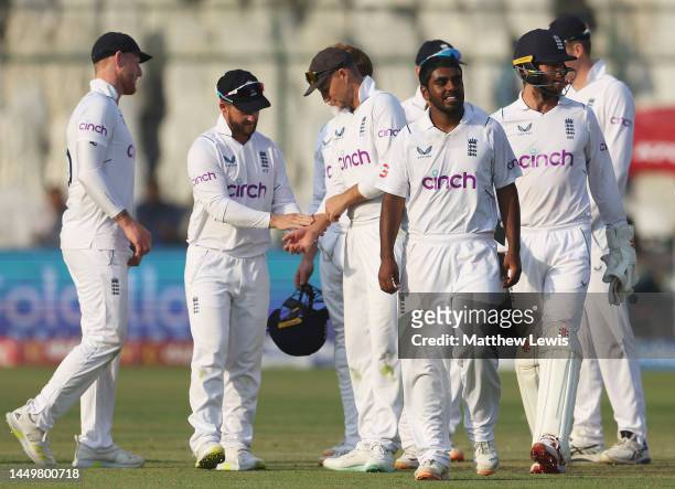 Rehan Ahmed of England is congratulated on the wicket of Faheem Ashraf of Pakistan, after bowling him LBW during day one of the Third Test match...