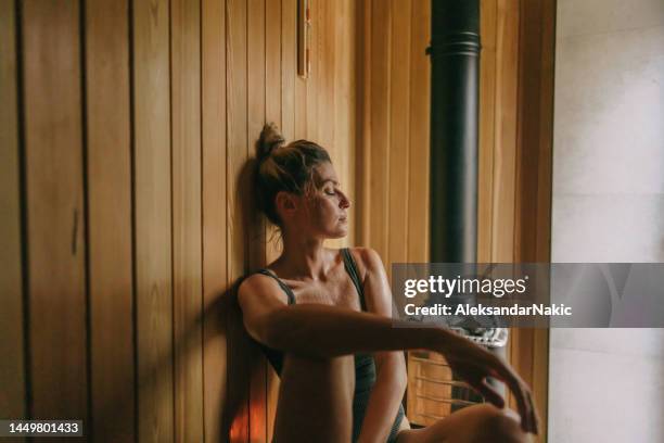 young woman in the sauna - sauna stockfoto's en -beelden