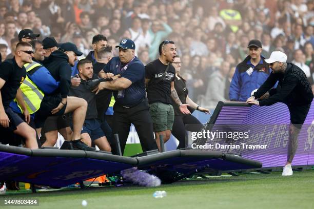 Fans storm the pitch in protest during the round eight A-League Men's match between Melbourne City and Melbourne Victory at AAMI Park, on December 17...