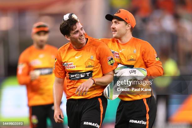 Jhye Richardson of the Scorchers celebrates the wicket of Jackson Bird of the Sixers with Josh Inglis during the Men's Big Bash League match between...