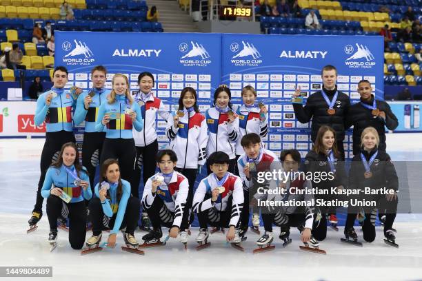 Team Belgium, Team Korea and Team Poland pose on podium after medal ceremony of Mixed Team 2000m Relay during the ISU World Cup Short Track at Halyk...