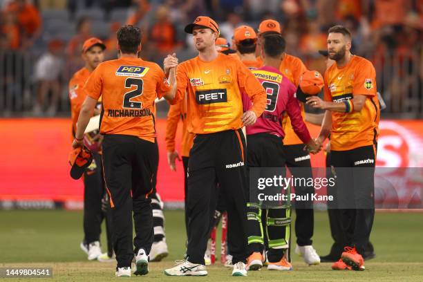 Jhye Richardson and Ashton Turner of the Scorchers celebrate winning the Men's Big Bash League match between the Perth Scorchers and the Sydney...