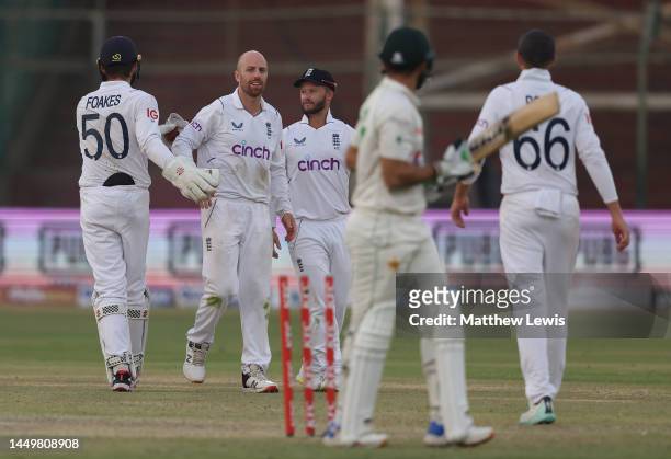 Ben Foakes of England and Jack Leach of England celebrate the wicket of Agha Salman of Pakistan during day one of the Third Test match between...