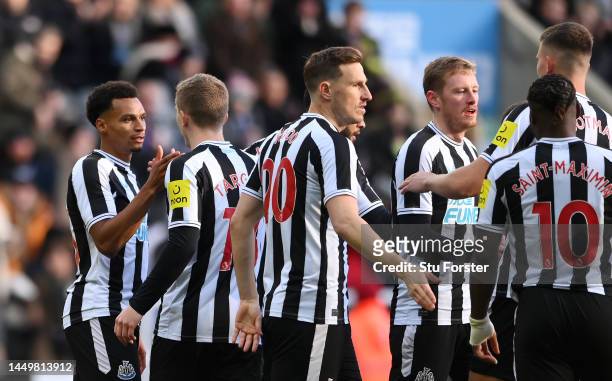 Jacob Murphy of Newcastle United celebrates after scoring their side's first goal with team mates during the friendly match between Newcastle United...