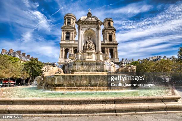 paris, the fountain and the sainte sulpice church under a cloudy sky - jean marc payet - fotografias e filmes do acervo