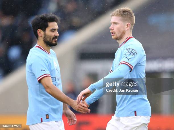 Kevin De Bruyne of Manchester City celebrates after scoring their side's first goal with Ilkay Gundogan during the friendly match between Manchester...