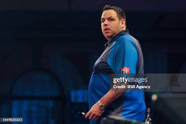 Adrian Lewis of England looks on during his First Round match at the 2022/23 Cazoo World Darts Championship at Alexandra Palace on December 16, 2022...