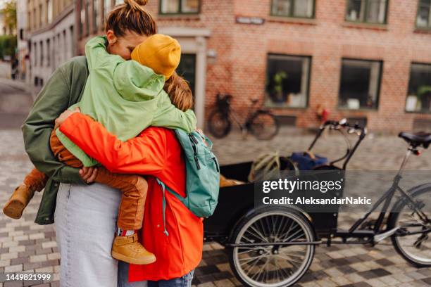 picking up brother from school - lifting stockfoto's en -beelden