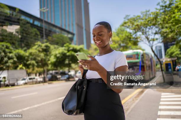 businesswoman on the street in the financial district - brazilian stock exchange stock pictures, royalty-free photos & images