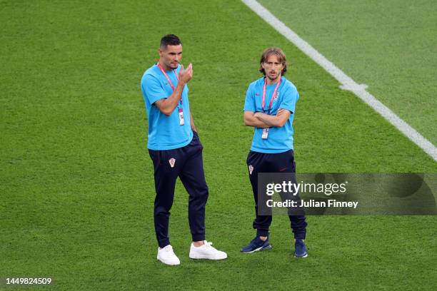 Dejan Lovren and Luka Modric of Croatia inspect the pitch prior to the FIFA World Cup Qatar 2022 3rd Place match between Croatia and Morocco at...