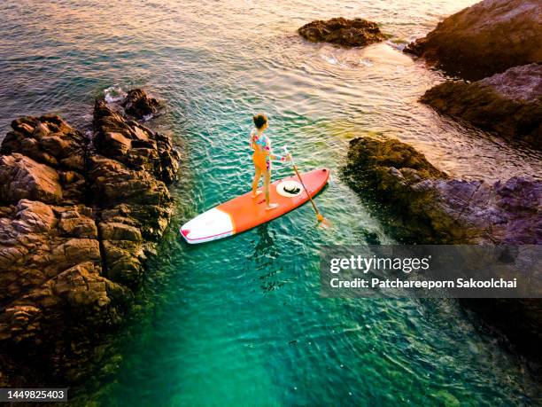 time paddle sea - sup stock pictures, royalty-free photos & images