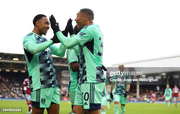 Kenny Tete of Fulham and Carlos Vinicius of Fulham celebrate as Vinicius scores his side's opening goal during the friendly match between Fulham and...