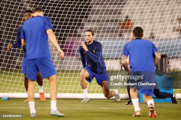 Adrien Rabiot of France stretches during the France Training Session ahead of their World Cup Final match against Argentina at Al Saad SC on December...