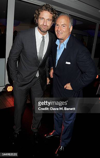 Actor Gerard Butler and Charles Finch attend the IWC and Finch's Quarterly Review Annual Filmmakers Dinner at Hotel Du Cap-Eden Roc on May 21, 2012...