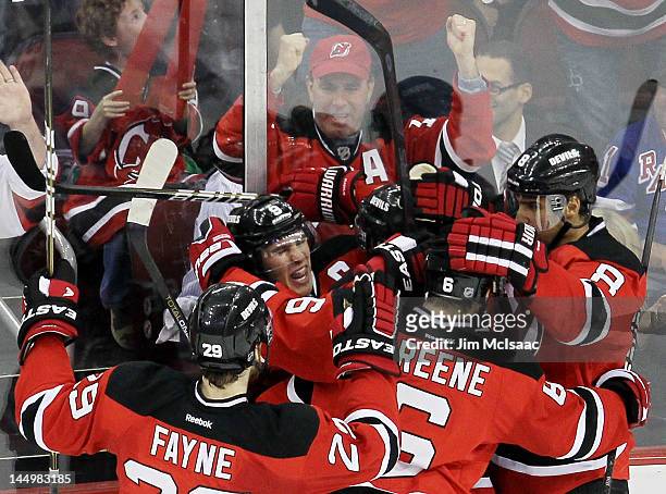 Travis Zajac of the New Jersey Devils celebrates his first period goal with Dainius Zubrus, Zach Parise Mark Fayne and Andy Greene of the New Jersey...