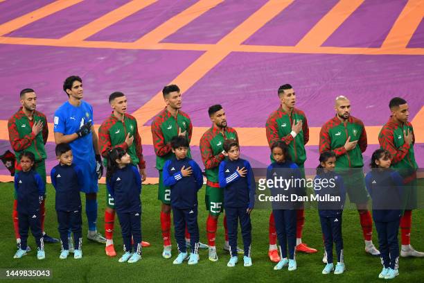 Morocco players sing their national anthem prior to the FIFA World Cup Qatar 2022 3rd Place match between Croatia and Morocco at Khalifa...