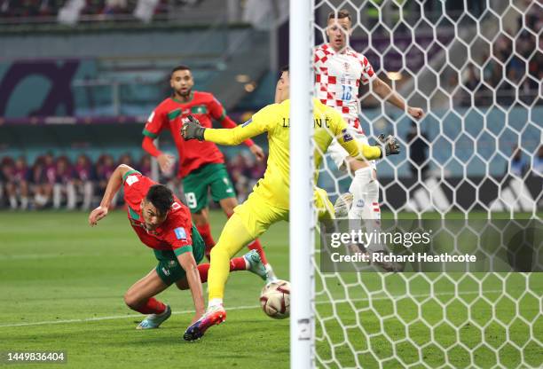 Achraf Dari of Morocco heads to score the team's first goal during the FIFA World Cup Qatar 2022 3rd Place match between Croatia and Morocco at...