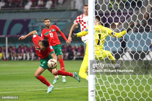 Achraf Dari of Morocco heads to score the team's first goal during the FIFA World Cup Qatar 2022 3rd Place match between Croatia and Morocco at...