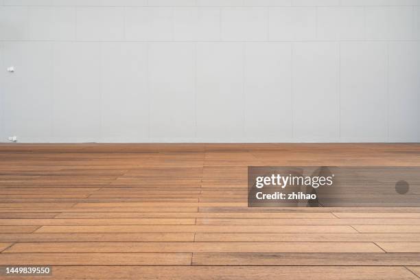 front view of wall and wooden floor - wood laminate flooring stock pictures, royalty-free photos & images