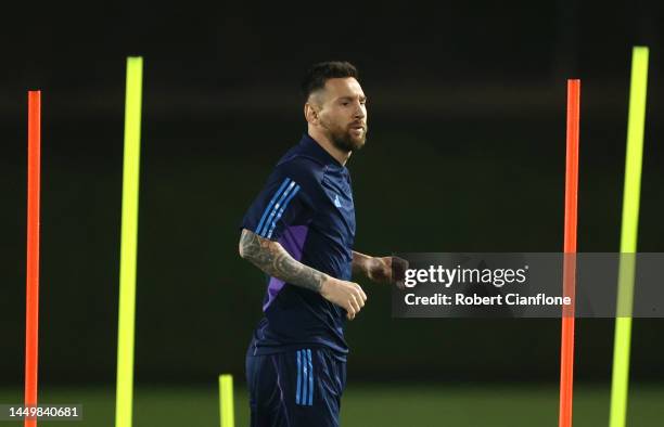 Lionel Messi of Argentina trains during the Argentina Training Session ahead of their World Cup Final match against France at Qatar University...