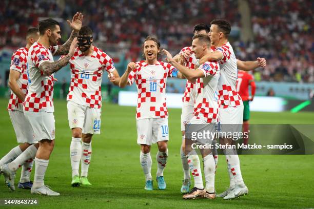 Mislav Orsic of Croatia celebrates as he scores the goal 2:1 with Luka Modric of Croatia Josip Juranovic of croatia Ivan Perisic of Croatia during...