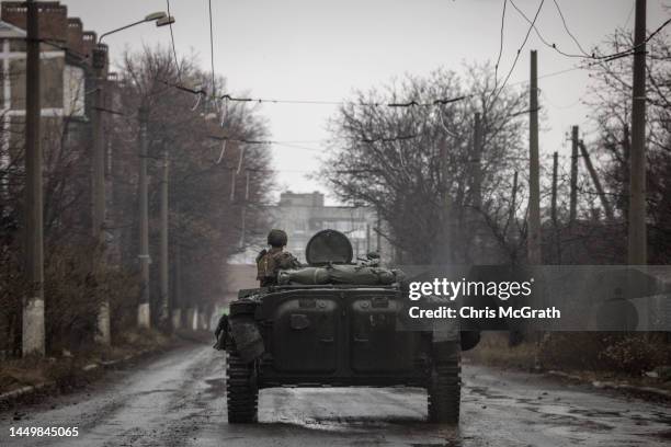 Member of the Ukrainian military drives an infantry fighting vehicle down a residential street on December 17, 2022 in Bakhmut, Ukraine. Russia...