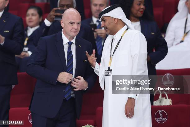 Gianni Infantino, president of FIFA, speaks with a member of the Qatar royal family during the FIFA World Cup Qatar 2022 3rd Place match between...