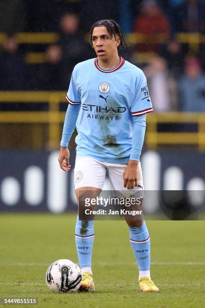 Rico Lewis of Manchester City in action during the friendly match between Manchester City and Girona at Manchester City Academy Stadium on December...