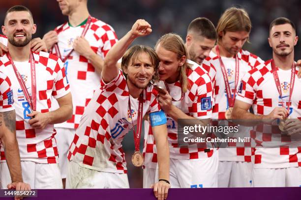 Luka Modric of Croatia celebrates with their FIFA World Cup Qatar 2022 third placed medal after the team's victory during the FIFA World Cup Qatar...