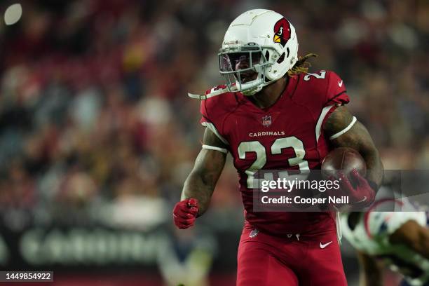 Corey Clement of the Arizona Cardinals runs the ball against the New England Patriots at State Farm Stadium on December 12, 2022 in Glendale, Arizona.