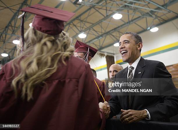 President Barack Obama greets graduatiing seniors before speaking at the Joplin High School Commencement Ceremony May 21, 2012 at Missouri Southern...