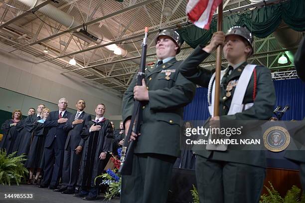 President Barack Obama with Missouri Governor Jay Nixon and Superintendent C.J. Huff listen to then national anthem during the Joplin High School...