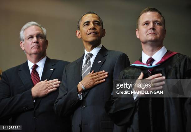 President Barack Obama with Missouri Governor Jay Nixon and Superintendent C.J. Huff listen to then national anthem during the Joplin High School...