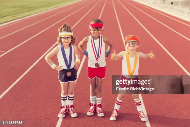 winning retro track racers - olympic athlete stock pictures, royalty-free photos & images