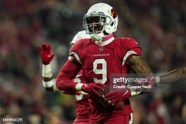 Isaiah Simmons of the Arizona Cardinals celebrates the turnover against the New England Patriots at State Farm Stadium on December 12, 2022 in...