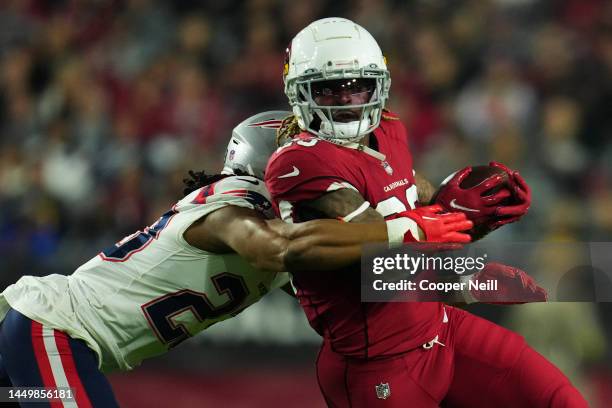Corey Clement of the Arizona Cardinals runs the ball against the New England Patriots at State Farm Stadium on December 12, 2022 in Glendale, Arizona.